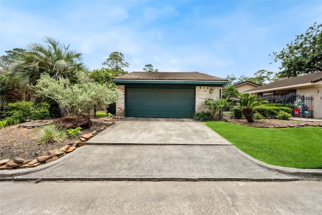 view of front of property featuring fence, concrete driveway, and brick siding