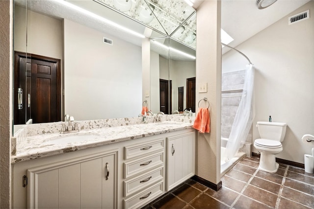bathroom with visible vents, a sink, a shower with shower curtain, and toilet