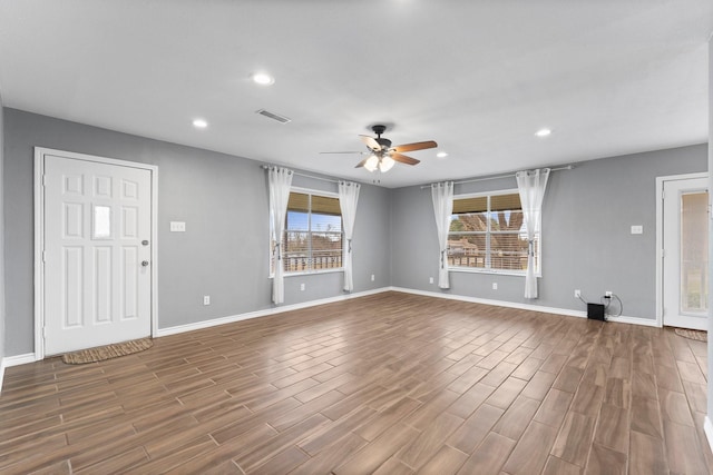 10 Hillcrest St, Point Blank, TX 77364 - unfurnished living room with ceiling fan, baseboards, visible vents, and recessed lighting