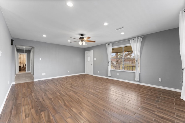 10 Hillcrest St, Point Blank, TX 77364 - unfurnished living room with dark wood-style floors, baseboards, visible vents, recessed lighting, and a ceiling fan