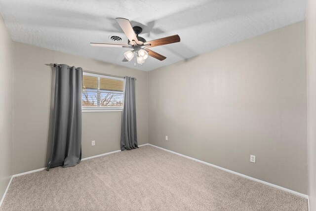 10 Hillcrest St, Point Blank, TX 77364 - unfurnished room with light carpet, a ceiling fan, and baseboards