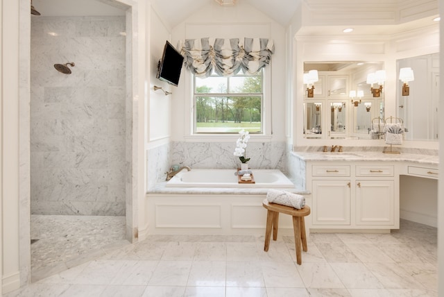 bathroom with a bath, vanity, marble finish floor, and a walk in shower