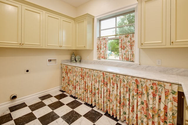 clothes washing area with cabinet space, washer hookup, baseboards, and electric dryer hookup