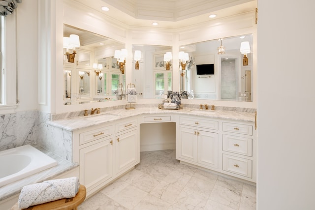 full bath featuring double vanity, a garden tub, ornamental molding, and a sink
