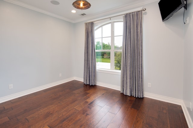 spare room featuring crown molding, visible vents, baseboards, dark wood-style floors, and recessed lighting