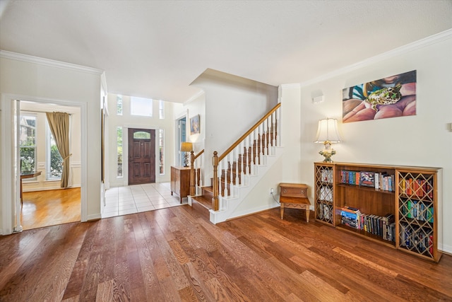 7930 Tizerton Ct, Spring, TX 77379 - entrance foyer with wood finished floors, ornamental molding, stairway, and baseboards