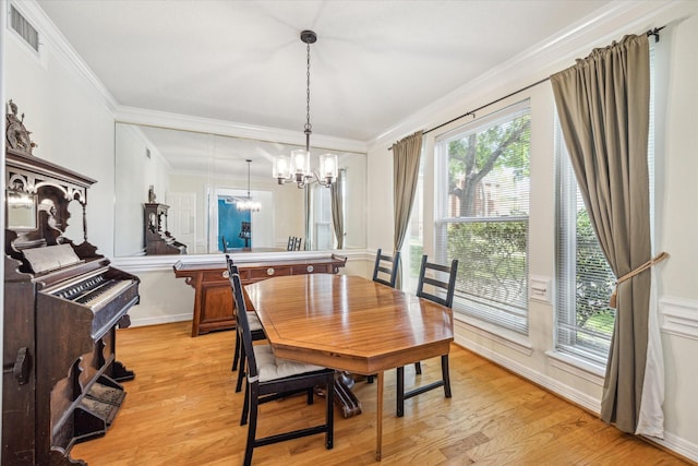 7930 Tizerton Ct, Spring, TX 77379 - dining room with a chandelier, light wood-style flooring, ornamental molding, and baseboards