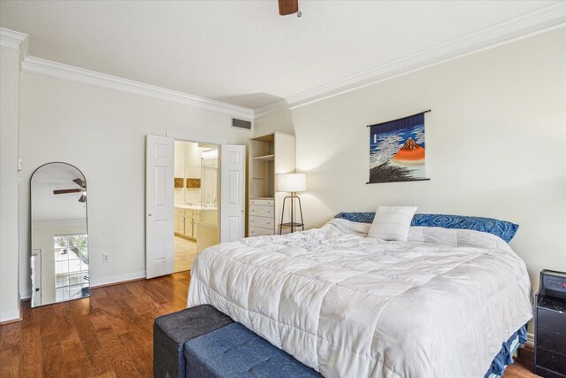 7930 Tizerton Ct, Spring, TX 77379 - bedroom with crown molding, wood finished floors, ensuite bath, baseboards, and a ceiling fan