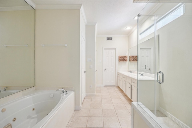 7930 Tizerton Ct, Spring, TX 77379 - bathroom featuring ornamental molding, a tub with jets, double vanity, baseboards, and tile patterned floors