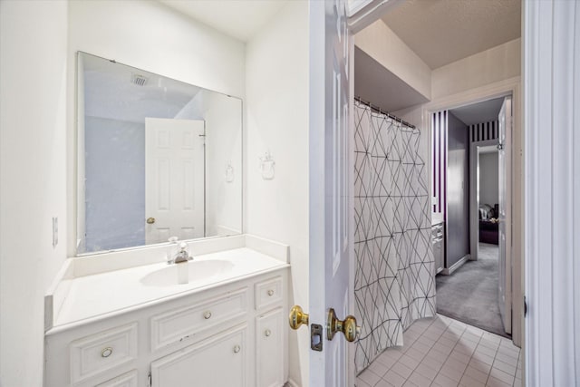 7930 Tizerton Ct, Spring, TX 77379 - bathroom with tile patterned flooring and vanity