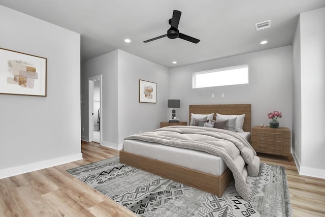 6817 Peerless St, Houston, TX 77021 - bedroom with ceiling fan, baseboards, light wood-style floors, and visible vents
