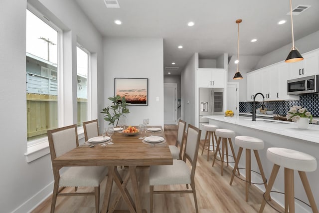 6817 Peerless St, Houston, TX 77021 - dining space featuring recessed lighting, visible vents, and light wood-style flooring