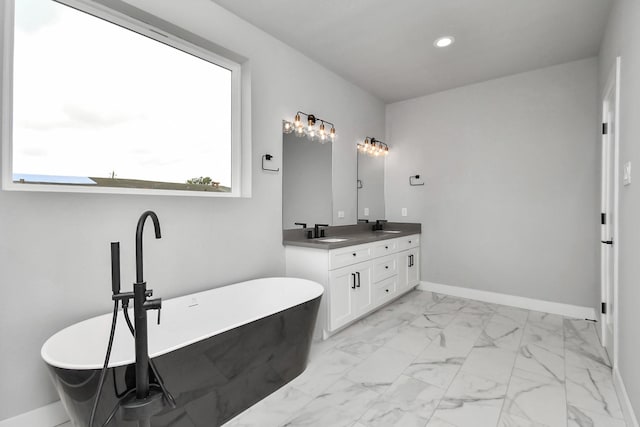 6817 Peerless St, Houston, TX 77021 - full bath with a soaking tub, a sink, double vanity, and recessed lighting