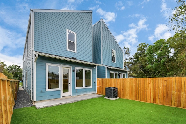6817 Peerless St, Houston, TX 77021 - back of property with a yard, a patio area, central AC, and a fenced backyard