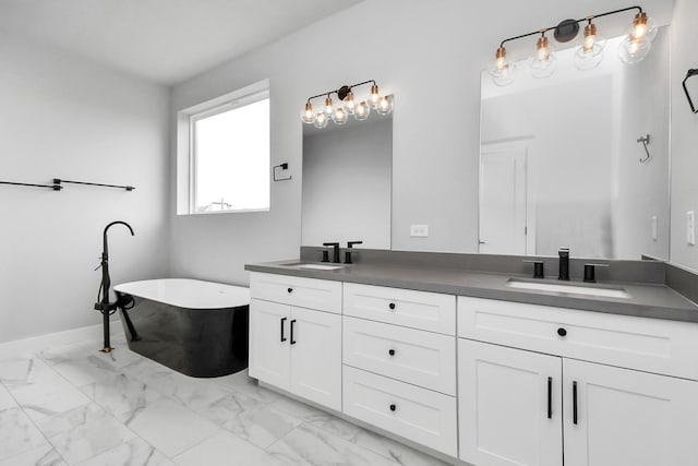 6817 Peerless St, Houston, TX 77021 - full bathroom with marble finish floor, a sink, double vanity, and a freestanding bath