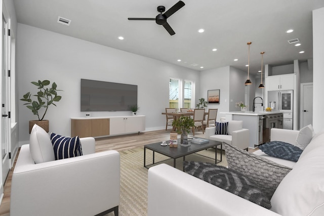 6817 Peerless St, Houston, TX 77021 - living area with light wood-type flooring, visible vents, recessed lighting, and ceiling fan