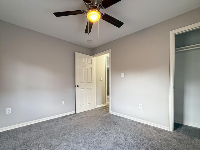unfurnished bedroom featuring a closet, carpet flooring, baseboards, and ceiling fan