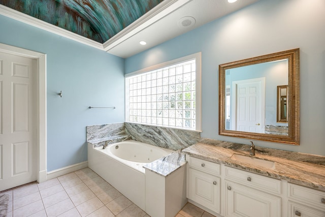 bathroom featuring recessed lighting, tile patterned flooring, a whirlpool tub, vanity, and baseboards
