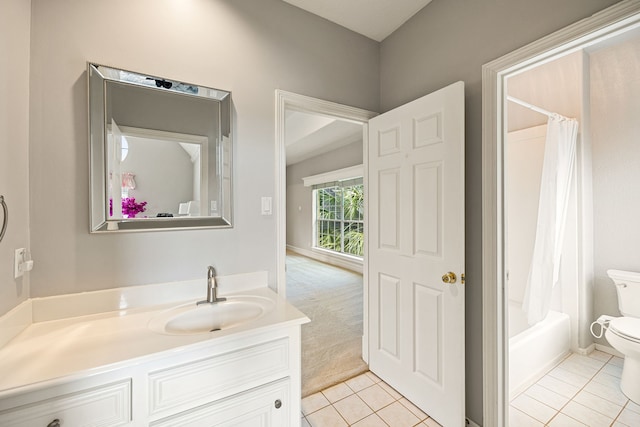 full bathroom featuring tile patterned floors, vanity, shower / bathtub combination with curtain, and toilet