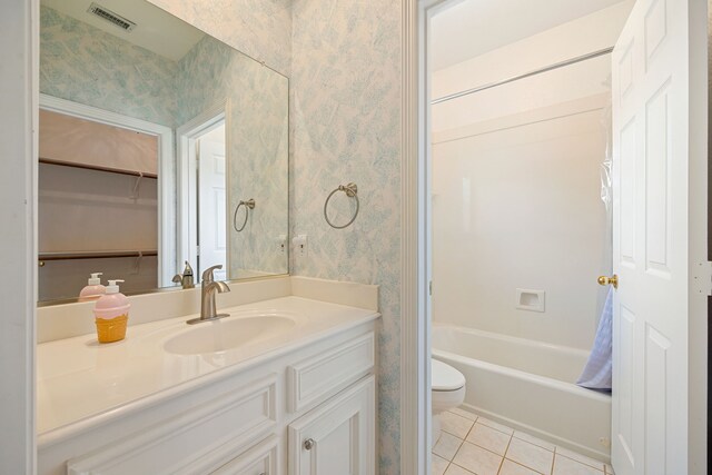 13602 Copeland Oaks Blvd, Cypress, TX 77429 - full bath with wallpapered walls, toilet, vanity, tile patterned flooring, and shower / bath combo
