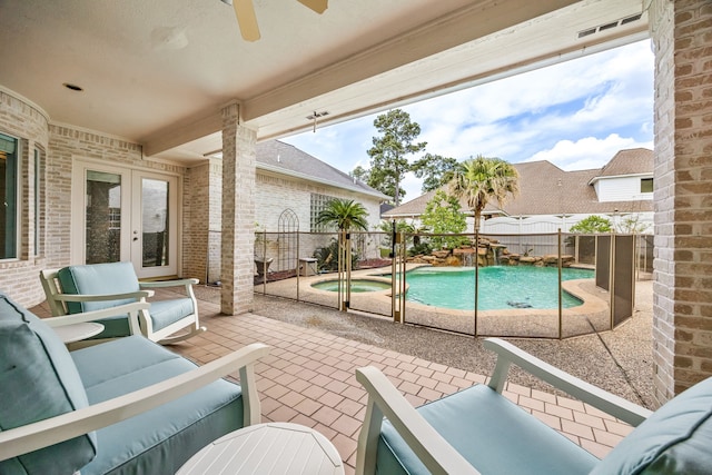view of swimming pool with a fenced in pool, a fenced backyard, ceiling fan, french doors, and a patio