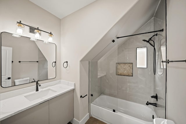 bathroom with shower / bathtub combination, vanity, toilet, and baseboards