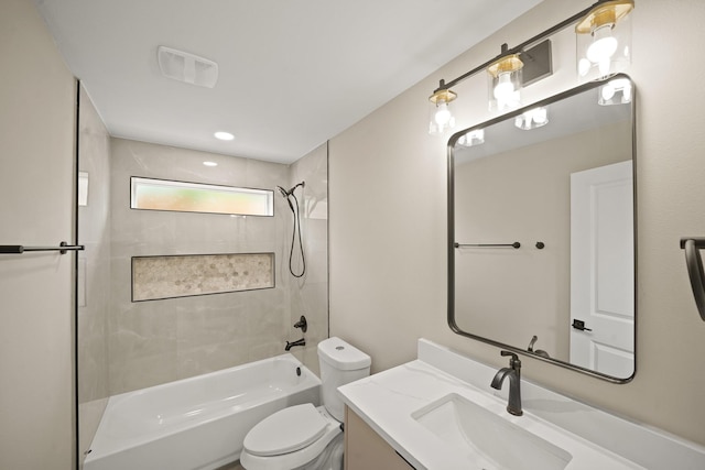 bathroom with shower / bathtub combination, visible vents, vanity, and toilet