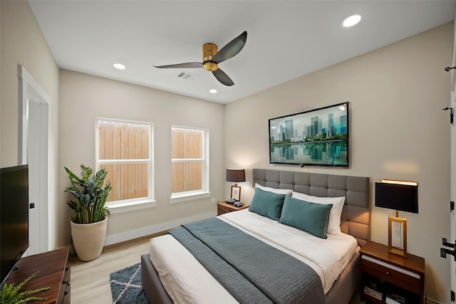 bedroom featuring baseboards, visible vents, recessed lighting, a ceiling fan, and wood finished floors