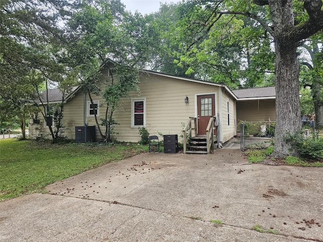 rear view of house with a lawn