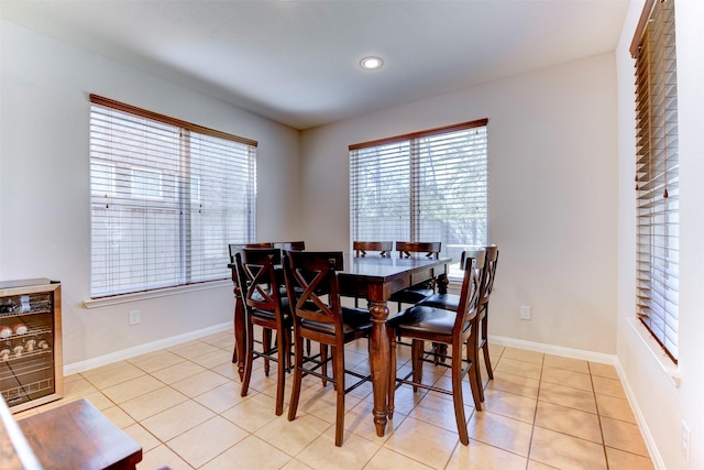 5002 Sawmill Terrace Ln, Spring, TX 77389 - dining area featuring plenty of natural light, light tile patterned floors, recessed lighting, baseboards, and wine cooler