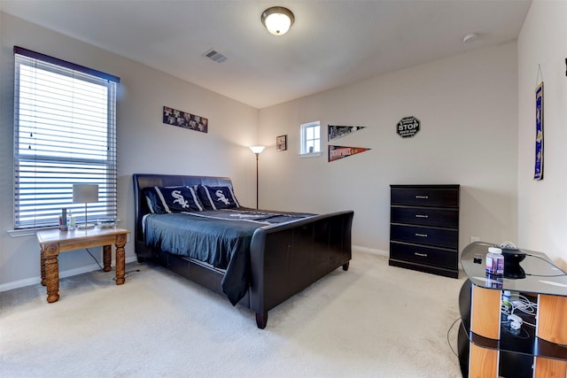 5002 Sawmill Terrace Ln, Spring, TX 77389 - bedroom featuring light carpet and baseboards