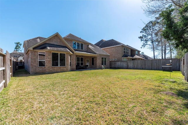 5002 Sawmill Terrace Ln, Spring, TX 77389 - back of property with brick siding and a patio area