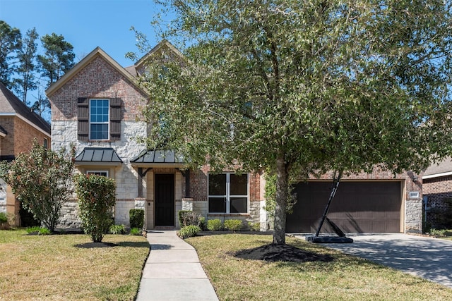 5002 Sawmill Terrace Ln, Spring, TX 77389 - view of front of house with a standing seam roof, stone siding, a front yard, an attached garage, and driveway