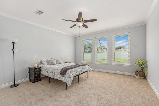 bedroom featuring baseboards, visible vents, carpet flooring, and crown molding