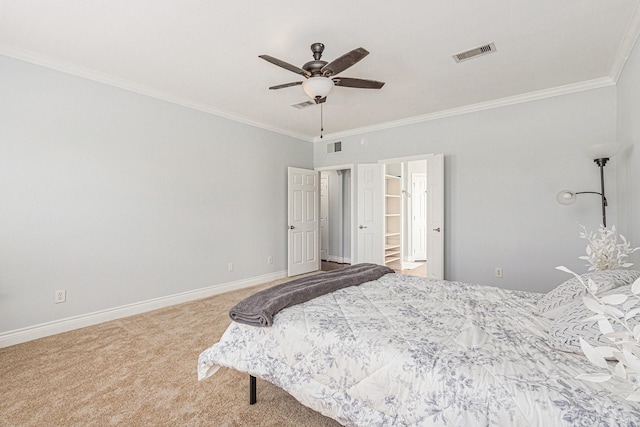 bedroom featuring baseboards, crown molding, carpet flooring, and visible vents