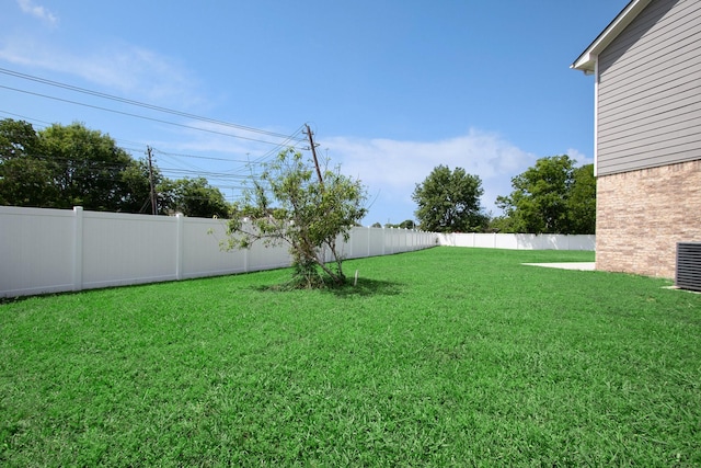 view of yard with a fenced backyard