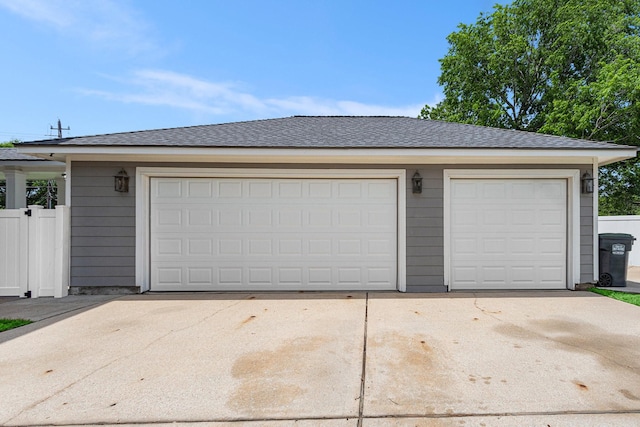 garage with concrete driveway