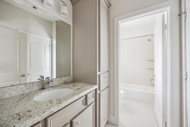 bathroom with tub / shower combination, visible vents, toilet, and vanity