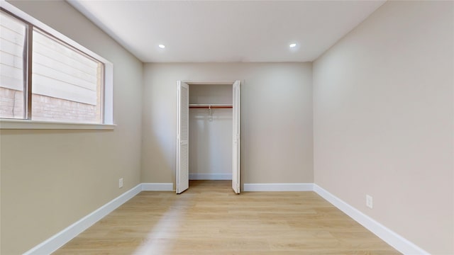 7126 Rio Blanco Dr, Houston, TX 77083 - unfurnished bedroom featuring recessed lighting, light wood-style floors, a closet, and baseboards