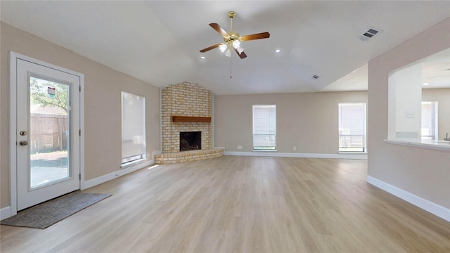 7126 Rio Blanco Dr, Houston, TX 77083 - unfurnished living room with vaulted ceiling, a healthy amount of sunlight, and light wood-style floors