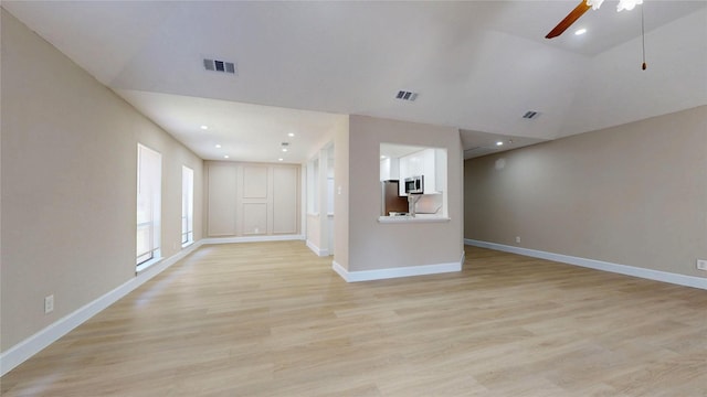 7126 Rio Blanco Dr, Houston, TX 77083 - unfurnished living room with light wood-style floors, visible vents, a ceiling fan, and baseboards