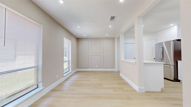 7126 Rio Blanco Dr, Houston, TX 77083 - interior space featuring baseboards, light wood-style floors, visible vents, and recessed lighting