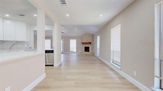 7126 Rio Blanco Dr, Houston, TX 77083 - interior space featuring light wood-type flooring, baseboards, visible vents, and lofted ceiling