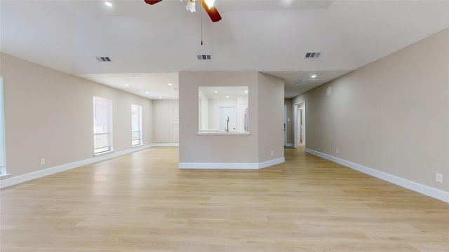 7126 Rio Blanco Dr, Houston, TX 77083 - unfurnished living room with light wood finished floors, visible vents, and a ceiling fan