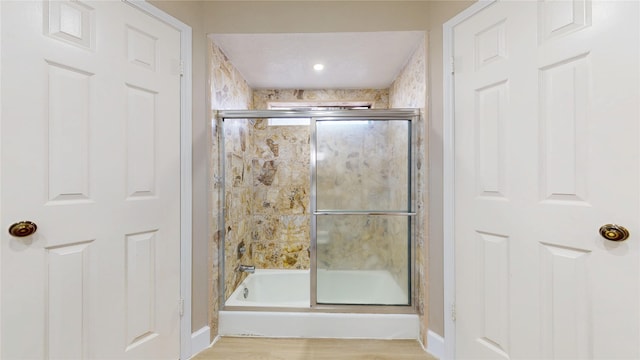 7126 Rio Blanco Dr, Houston, TX 77083 - bathroom featuring baseboards and a shower with door