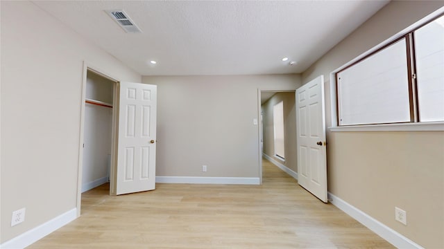7126 Rio Blanco Dr, Houston, TX 77083 - unfurnished bedroom featuring recessed lighting, visible vents, light wood finished floors, and baseboards
