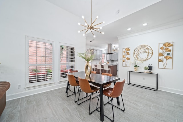 dining room featuring baseboards, crown molding, and a chandelier