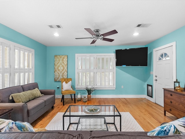 939 17th St, San Leon, TX 77539 - living room featuring a ceiling fan, wood finished floors, recessed lighting, and baseboards