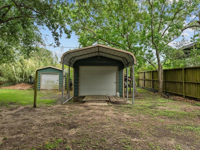 view of shed featuring fence