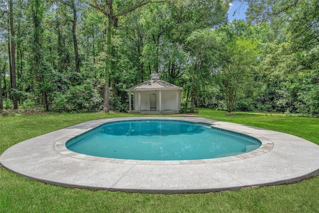 pool with a lawn and an outbuilding